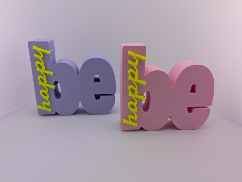 bymelli schriftzug "be happy" wohn deko aus dem 3d-druck in lila und rosa